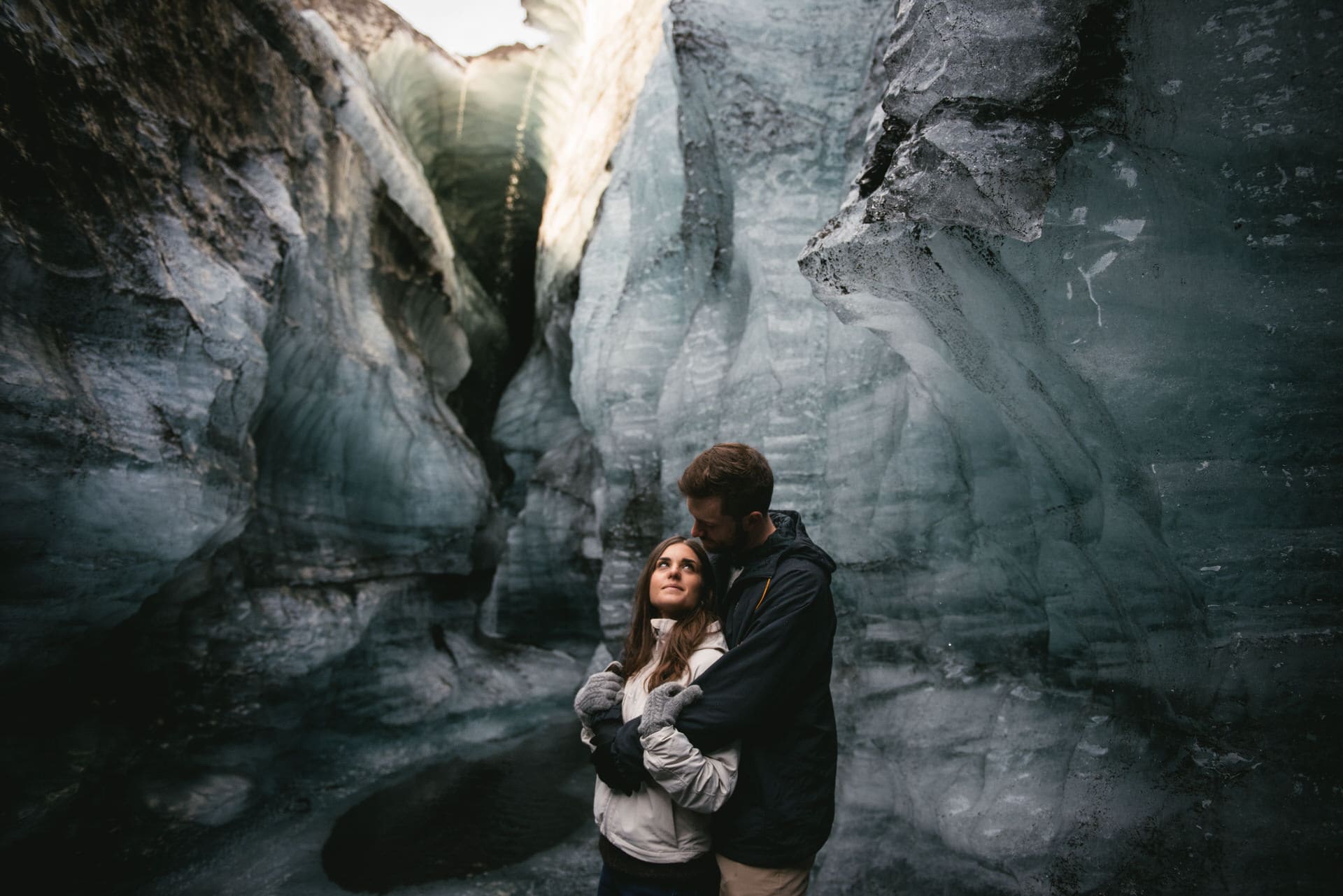 Couple posing in an ice cave after their elopement in Iceland