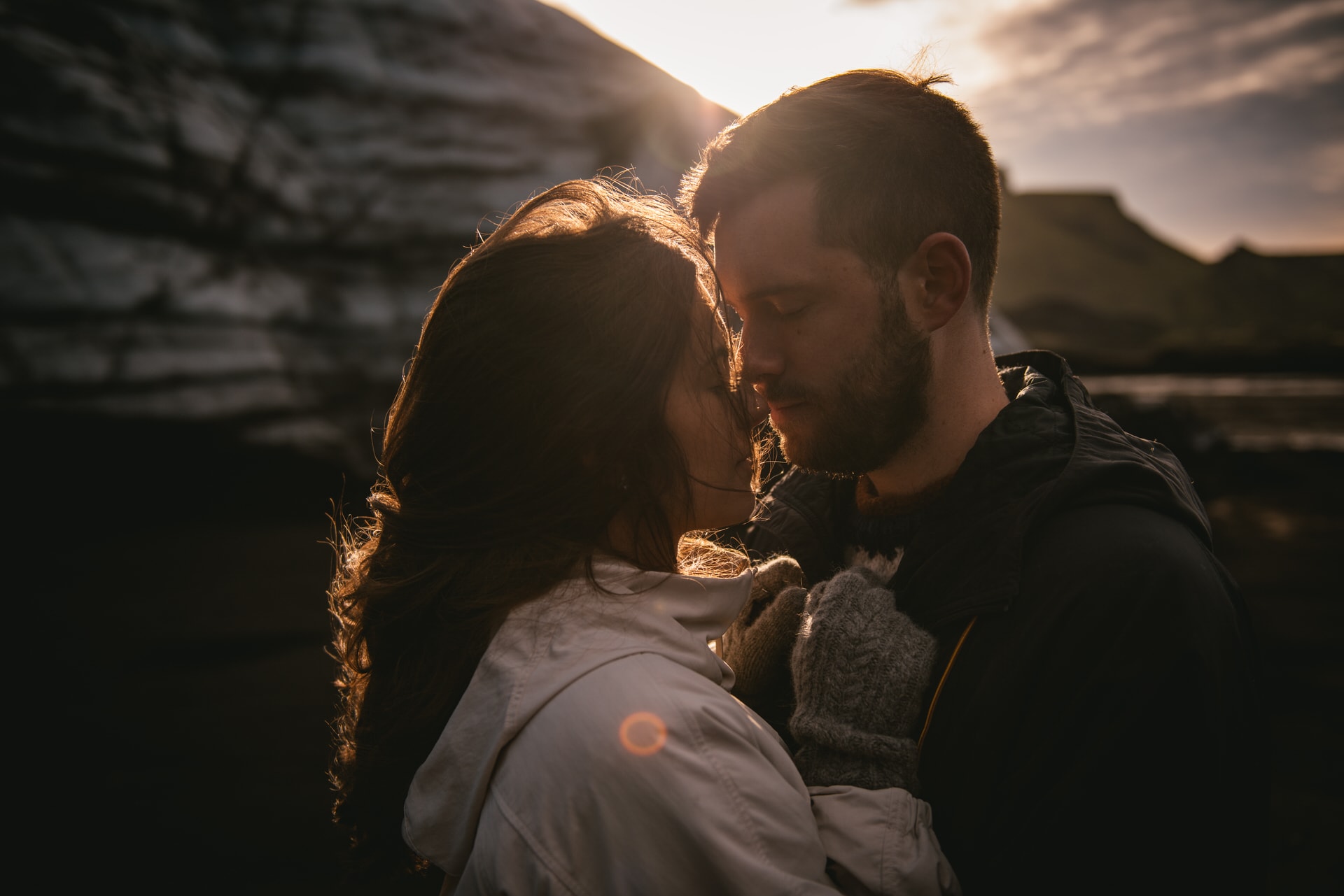 Couple kissing at sunrise in a glacier after their elopement in Iceland