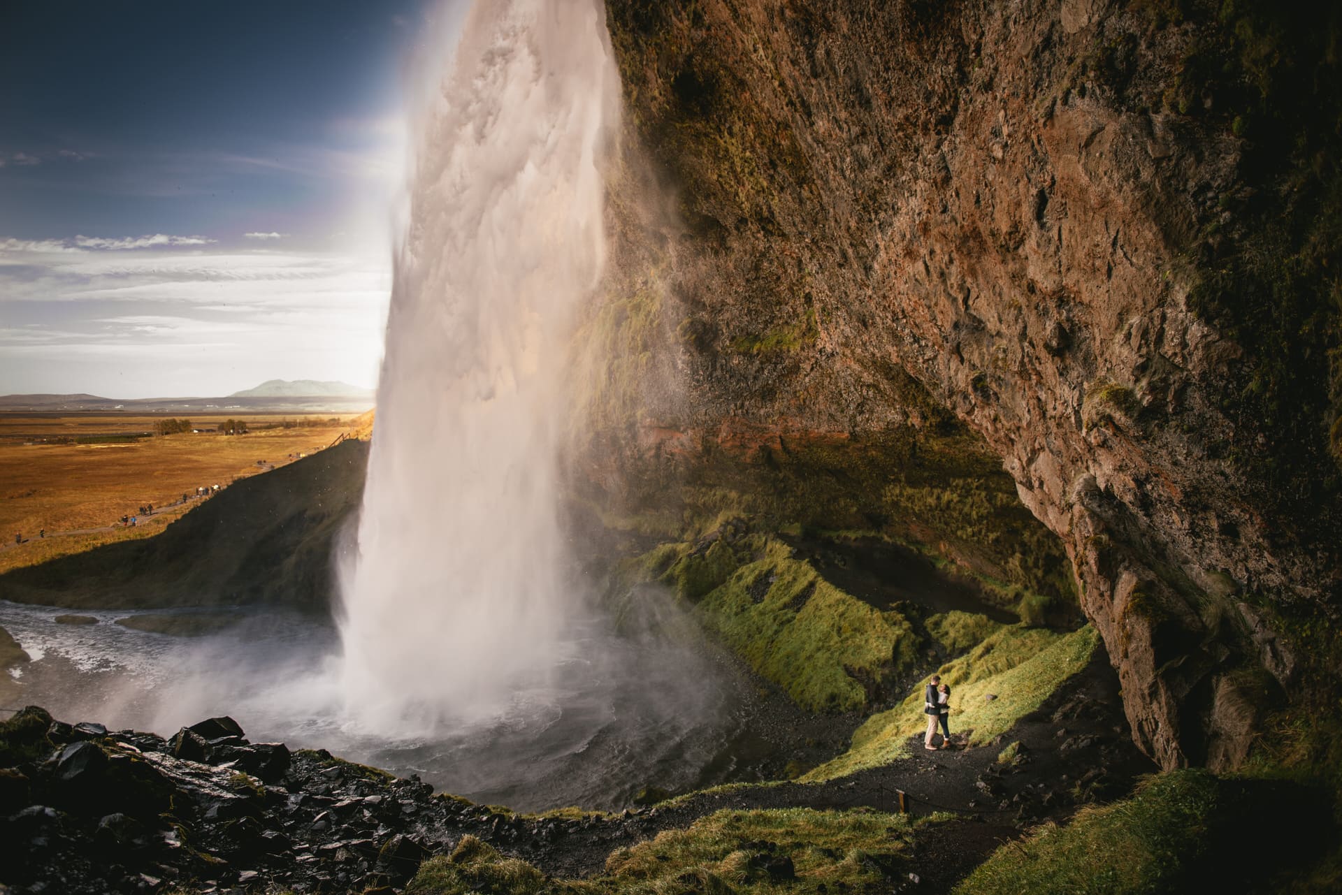 Couple next to Seljalandsfoss after their elopement in Iceland