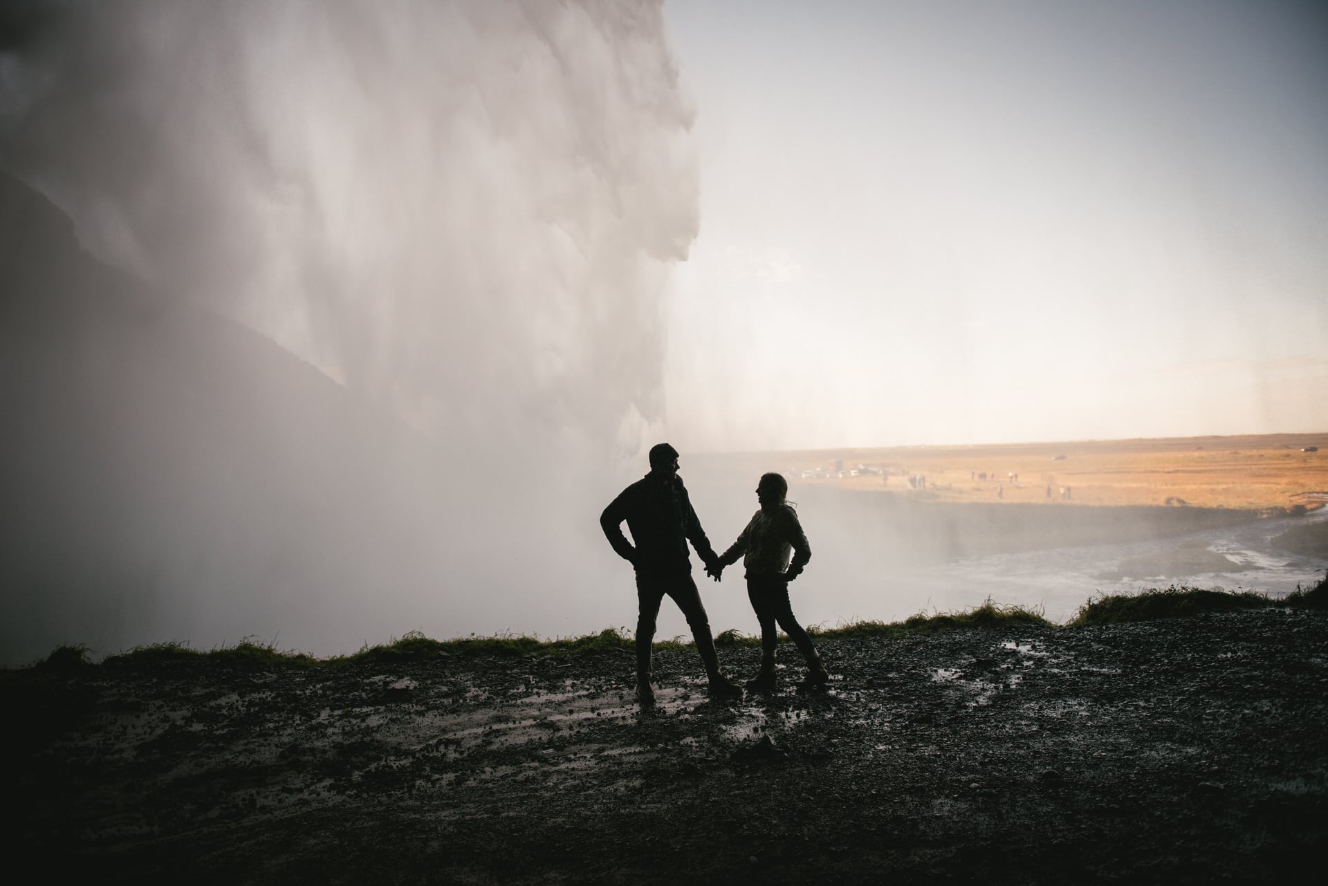 Couple next to Seljalandsfoss after their elopement in Iceland