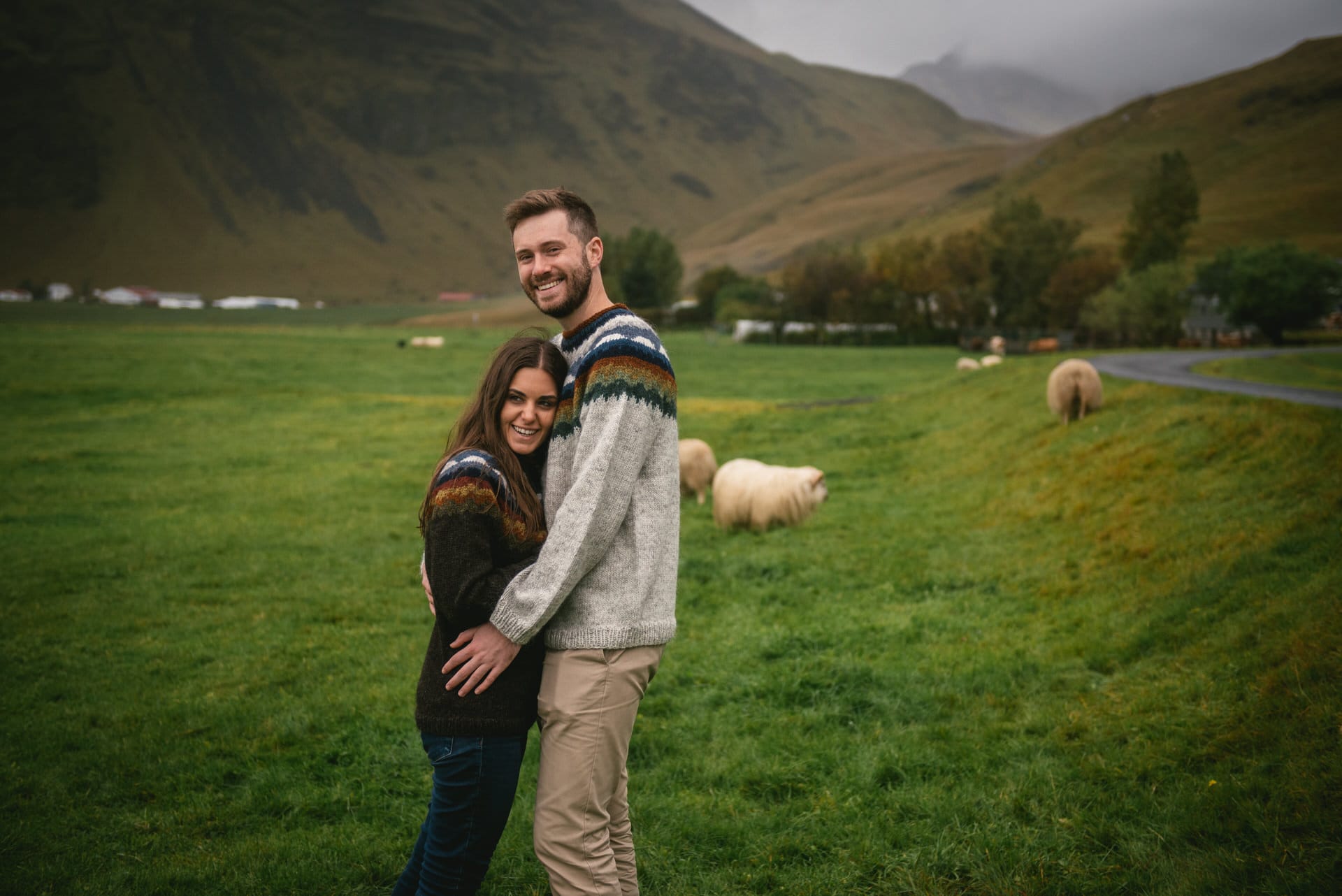 Couple with Icelandic sheep before their elopement in Iceland
