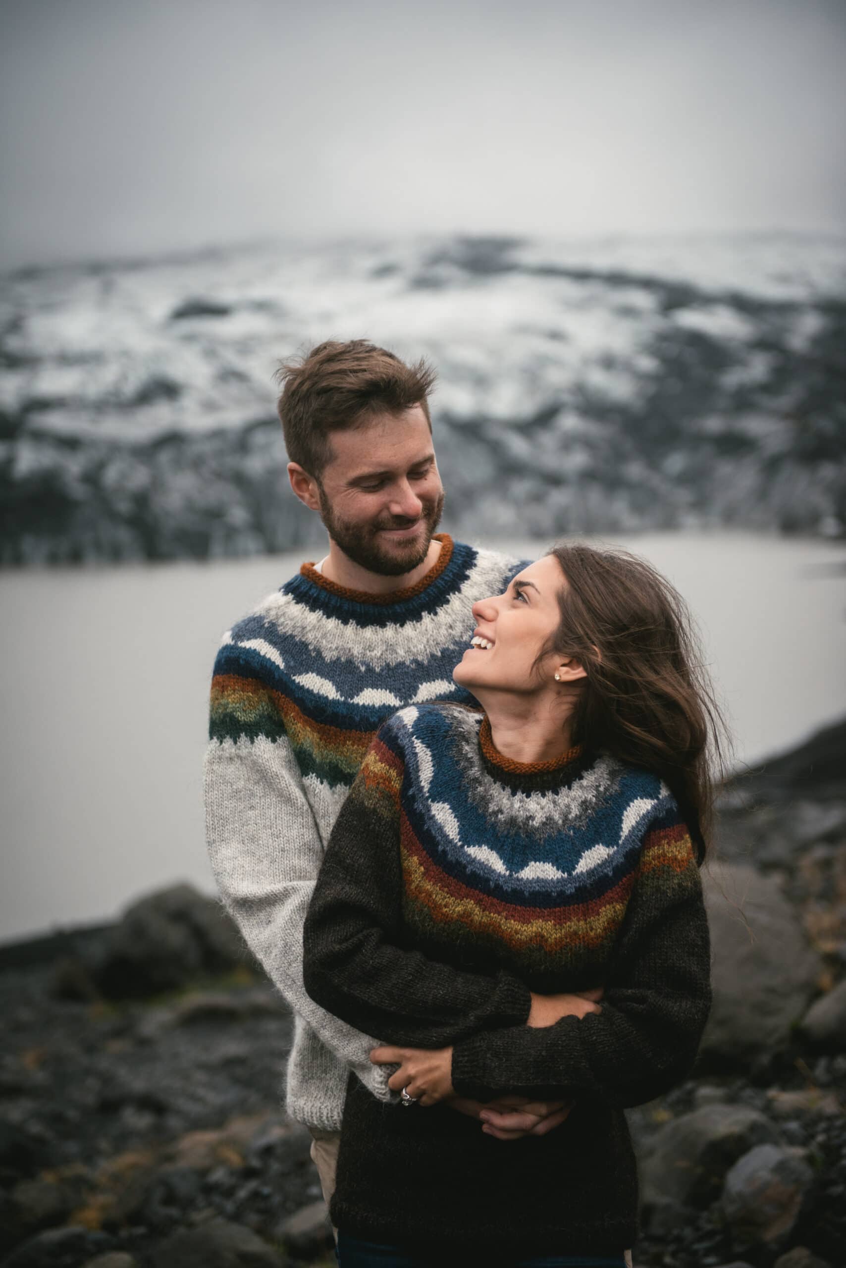 Couple with a glacier before their elopement in Iceland