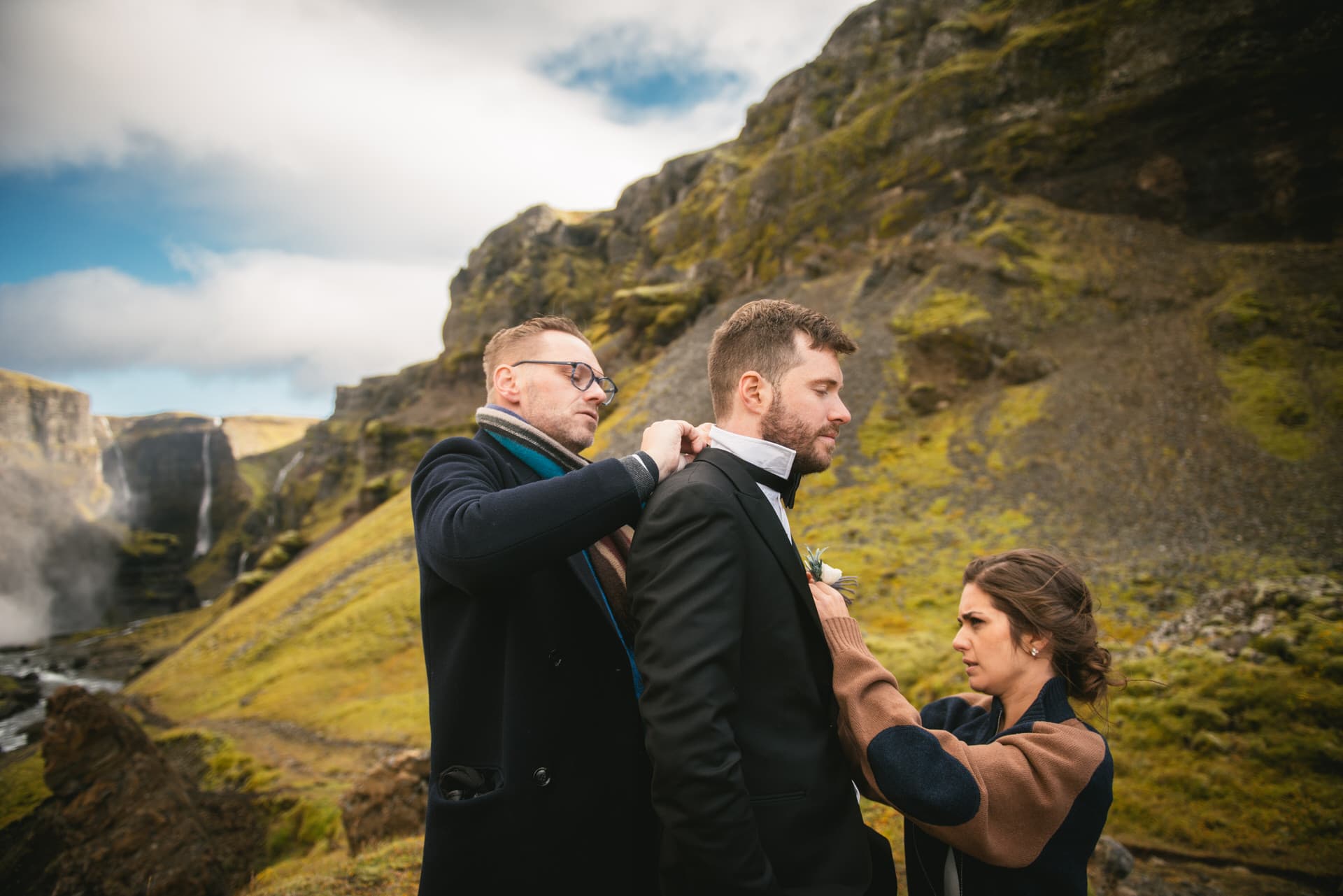 Groom getting the final touches on his suits on their elopement day in Iceland