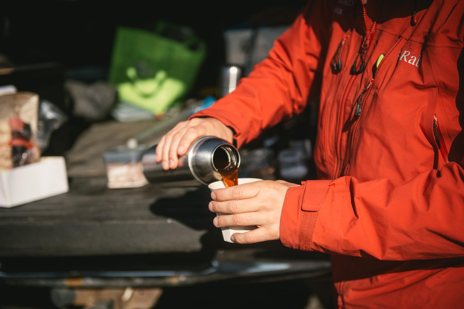 Icelandic guide pouring hot coffee in a mug