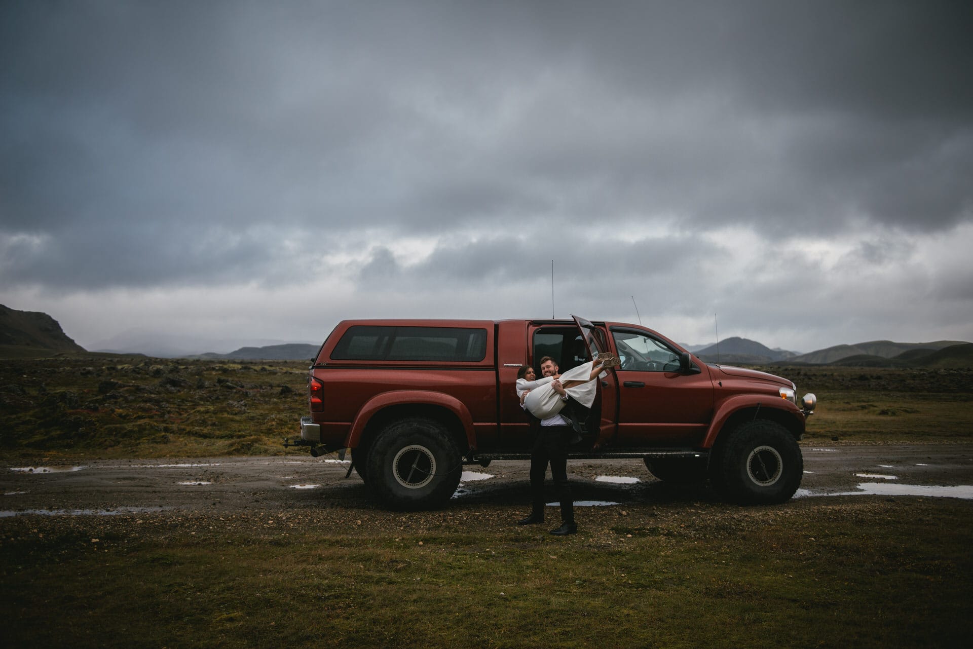 Couple having fun with their superjeep after their elopement in Iceland
