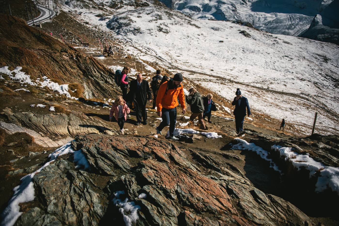 Group walking towards the ceremony spot on an elopement in Zermatt