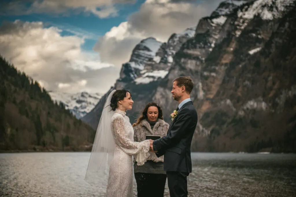 Bride and groom on their elopement ceremony by the side of a lake near Zurich