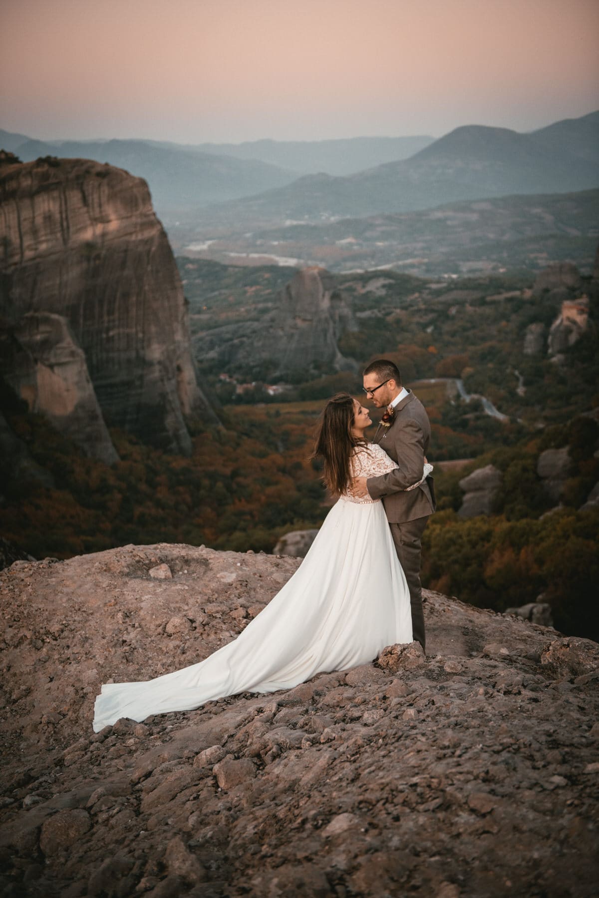 Couple doing their first dance on their day after photoshoot in the Meteora in Greece