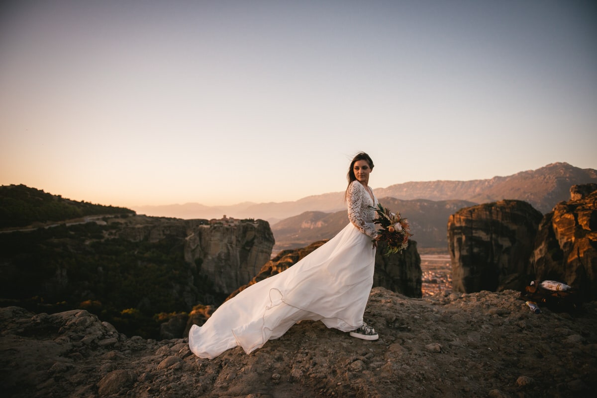 Bride posing on their day after photoshoot in the Meteora in Greece