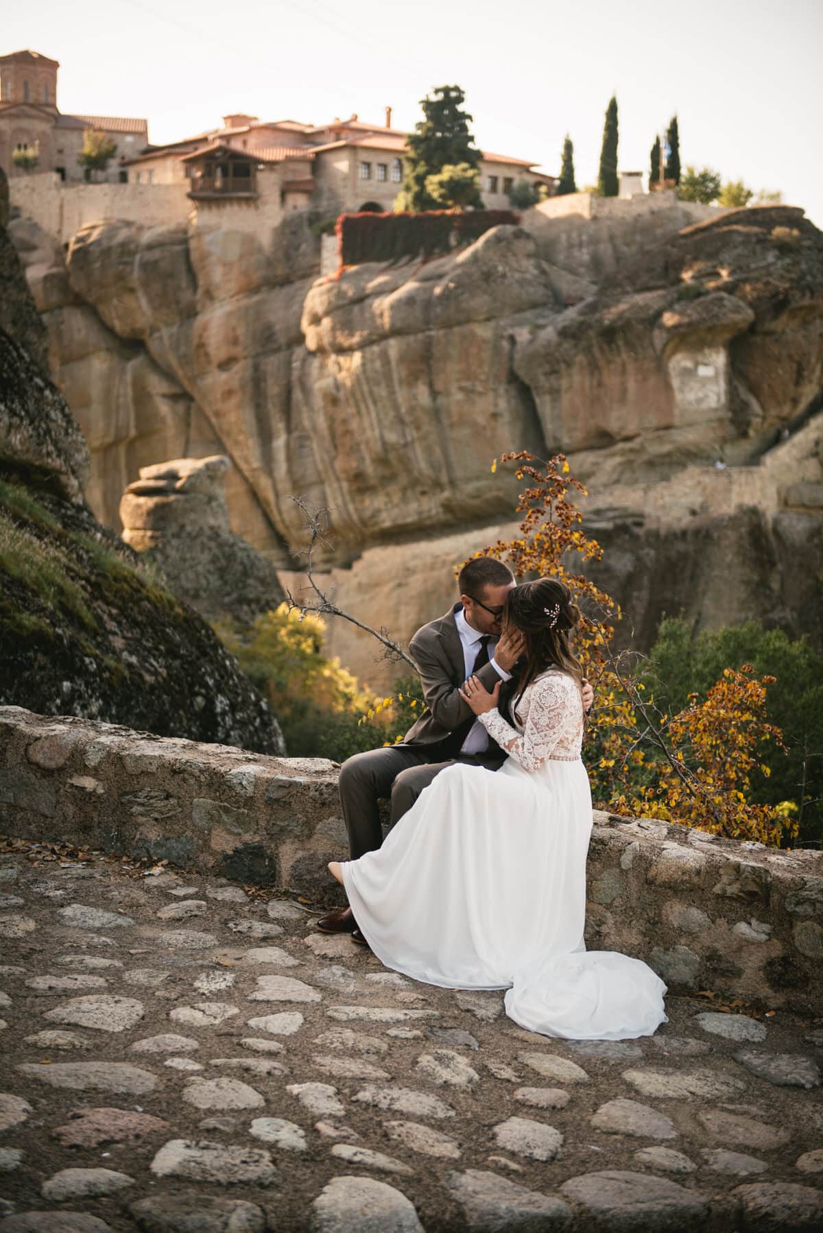 Bride and groom by the monasteries on an elopement day in the Meteora