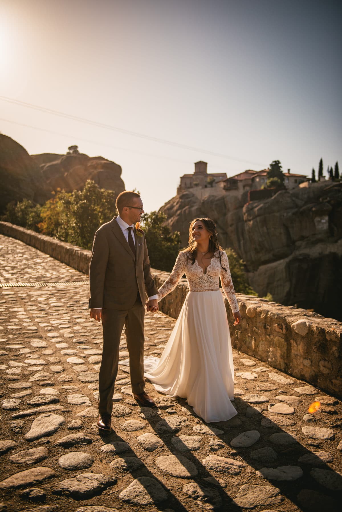Bride and groom walking on an elopement day in the Meteora