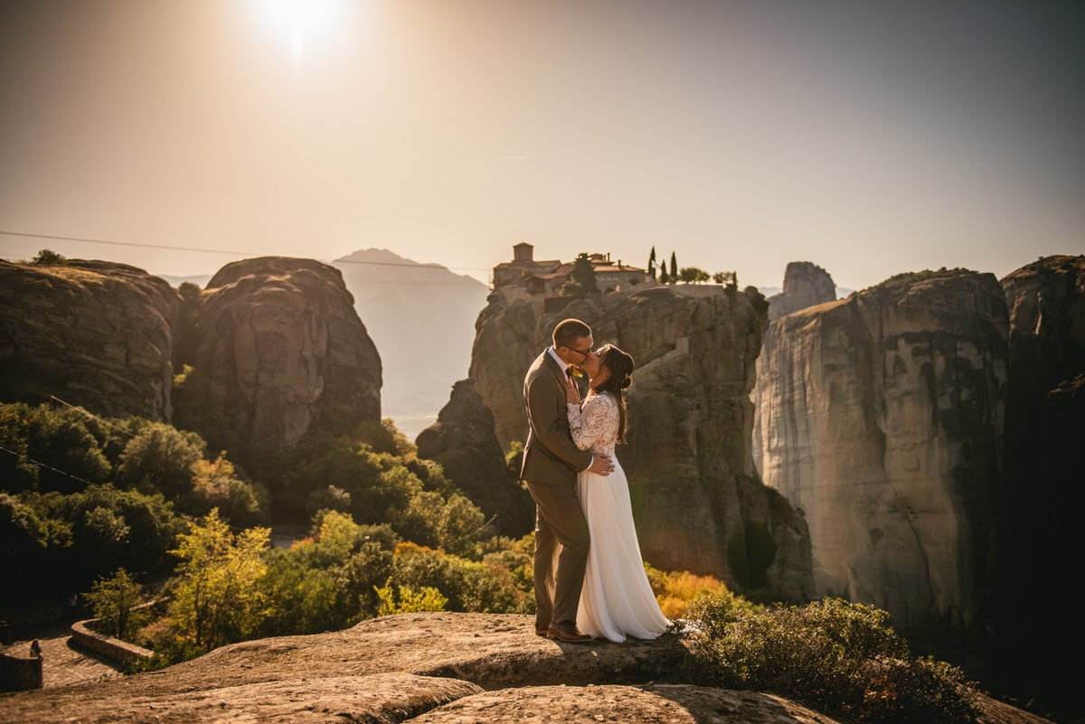 Bride and groom kissing on an elopement day in the Meteora