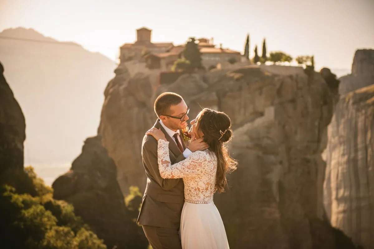 Bride and groom kissing on an elopement day in the Meteora