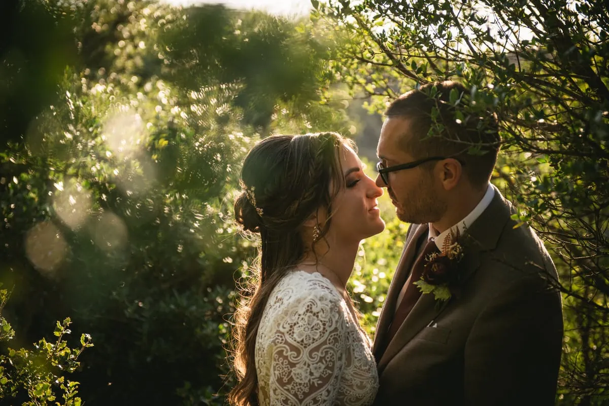 Bride and groom in the trees on an elopement day in the Meteora
