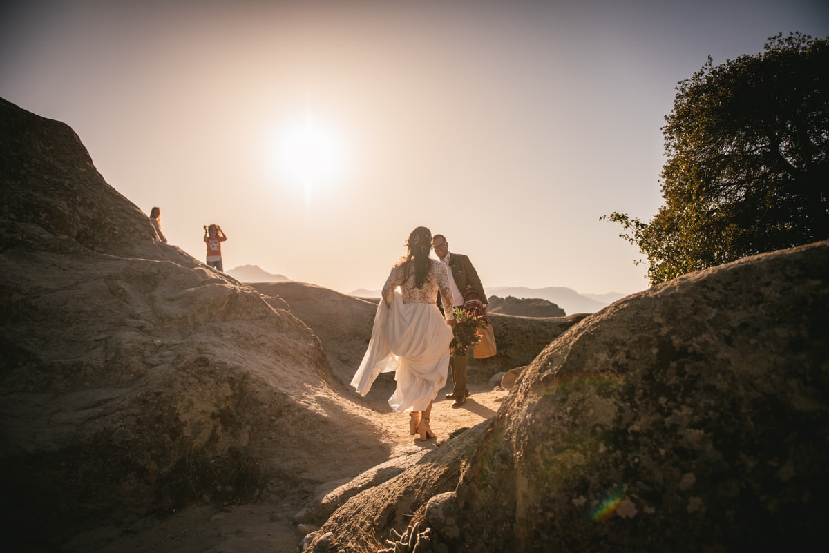 Couple walking on rocks on an elopement day in the Meteora