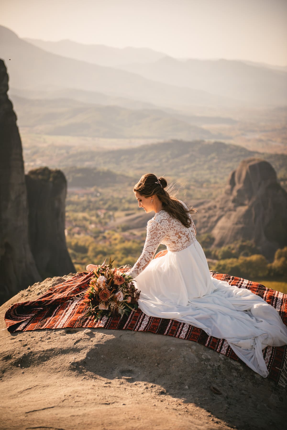 Bride getting the picnic ready on an elopement day in the Meteora
