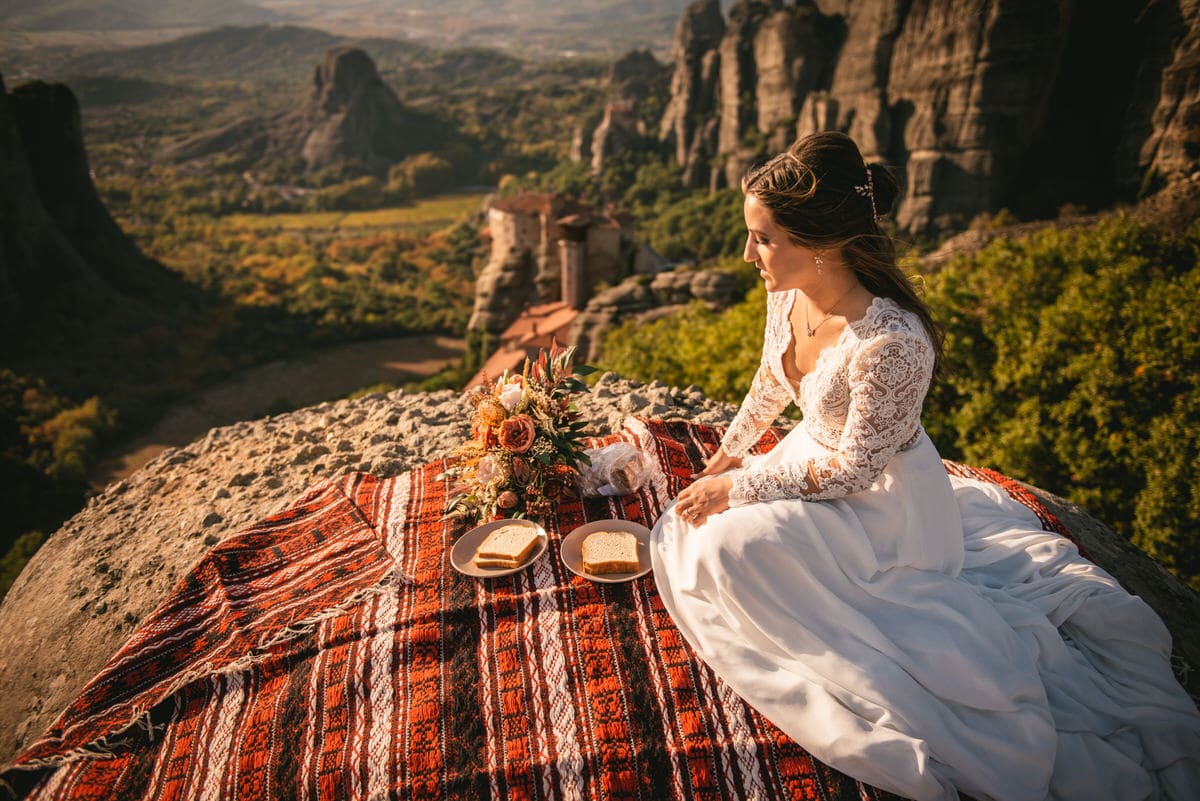 Bride on a rock on an elopement day in the Meteora