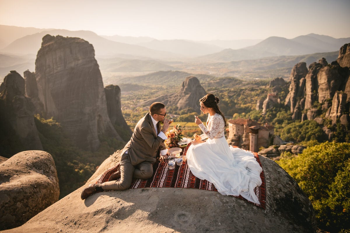 Bride and groom having a picnic on an elopement day in the Meteora