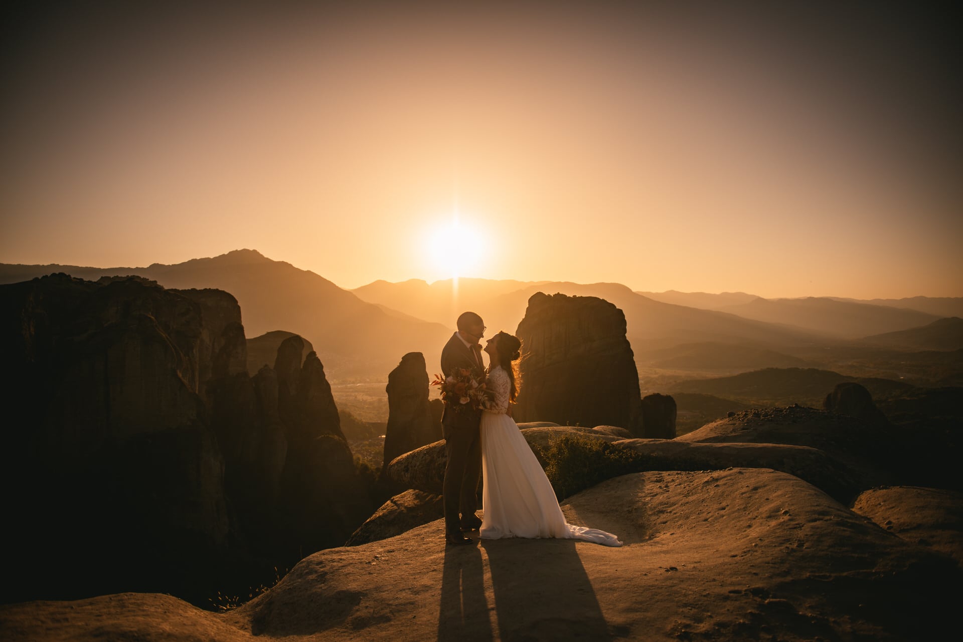 Couple at sunset on their Meteora wedding elopement