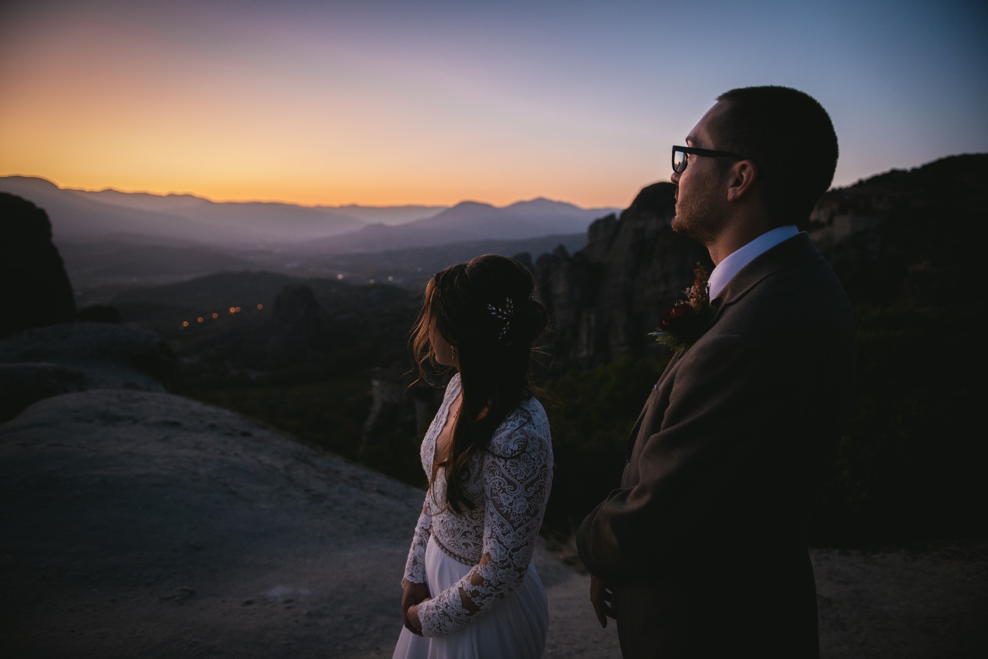 Couple enjoying the silent sunset on their Meteora wedding elopement