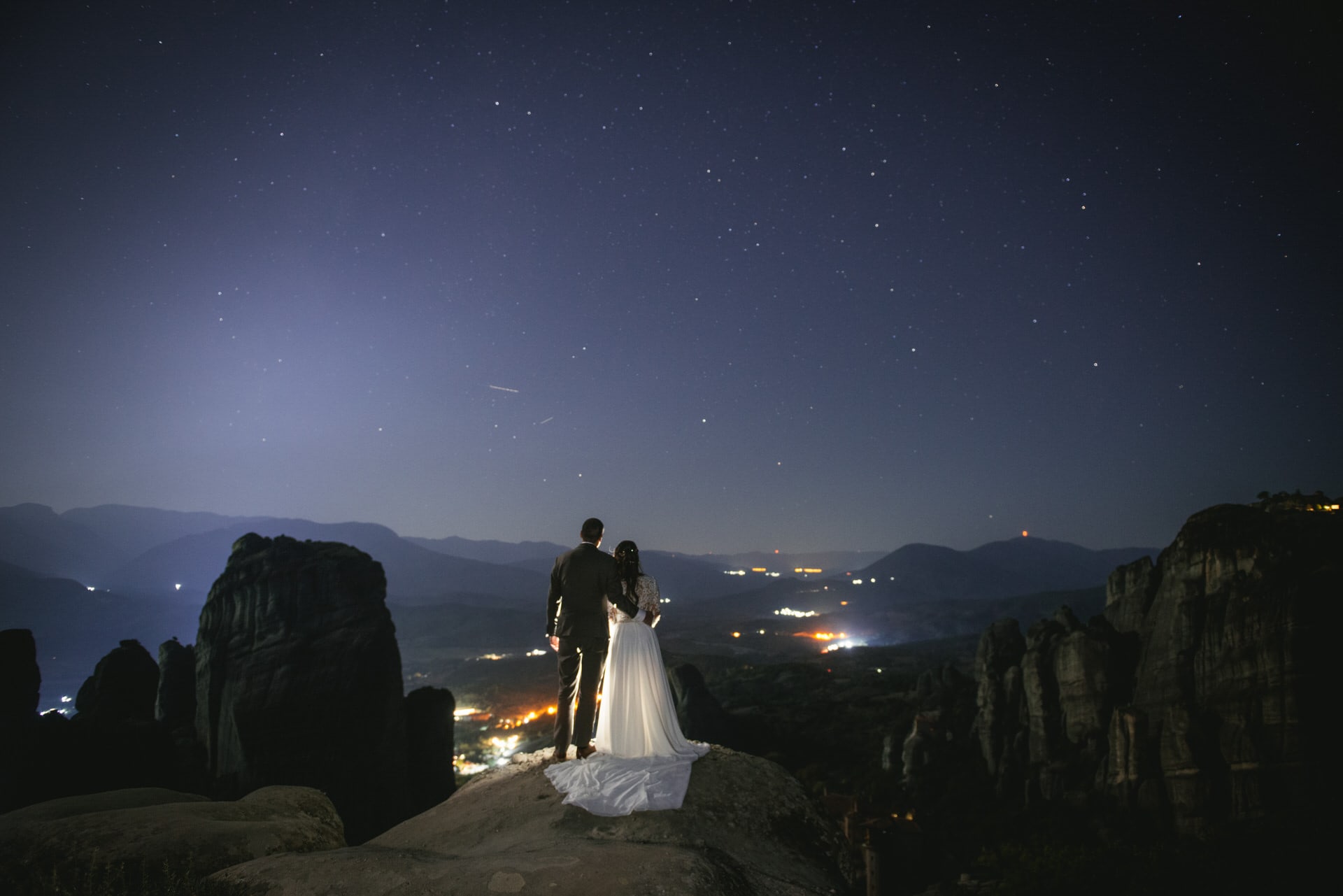 Couple looking at Kalambaka on their Meteora wedding elopement