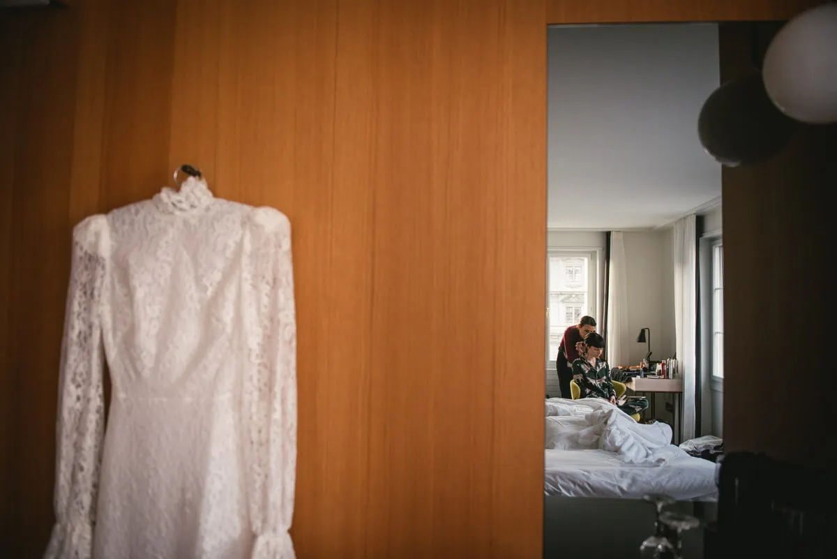 Bride getting ready in her hotel room on her elopement day near Zurich