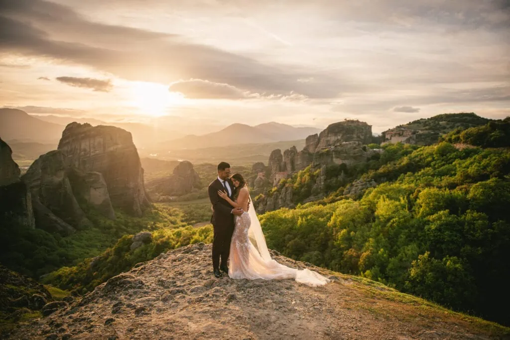 Couple doing a photoshoot at sunset on their elopement day in the Meteora