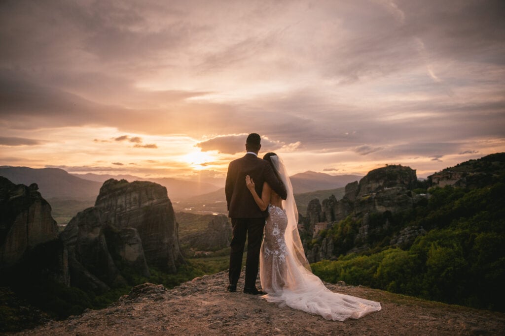 Couple doing a photoshoot at sunset on their elopement day in the Meteora