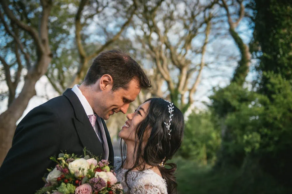 Close-up of the bride's radiant smile as she gazes at her partner during their Northern Ireland elopement.