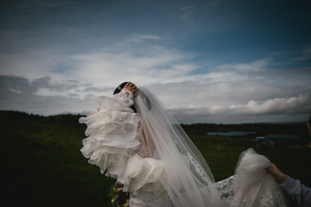 Dreamy shot of the bride's veil caught by the wind during their Northern Ireland elopement.