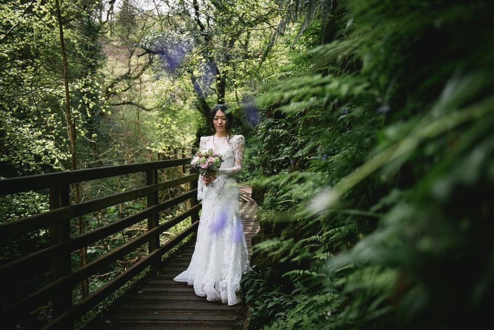 Glimpse of the bride's delicate lace wedding gown during their Northern Ireland elopement.