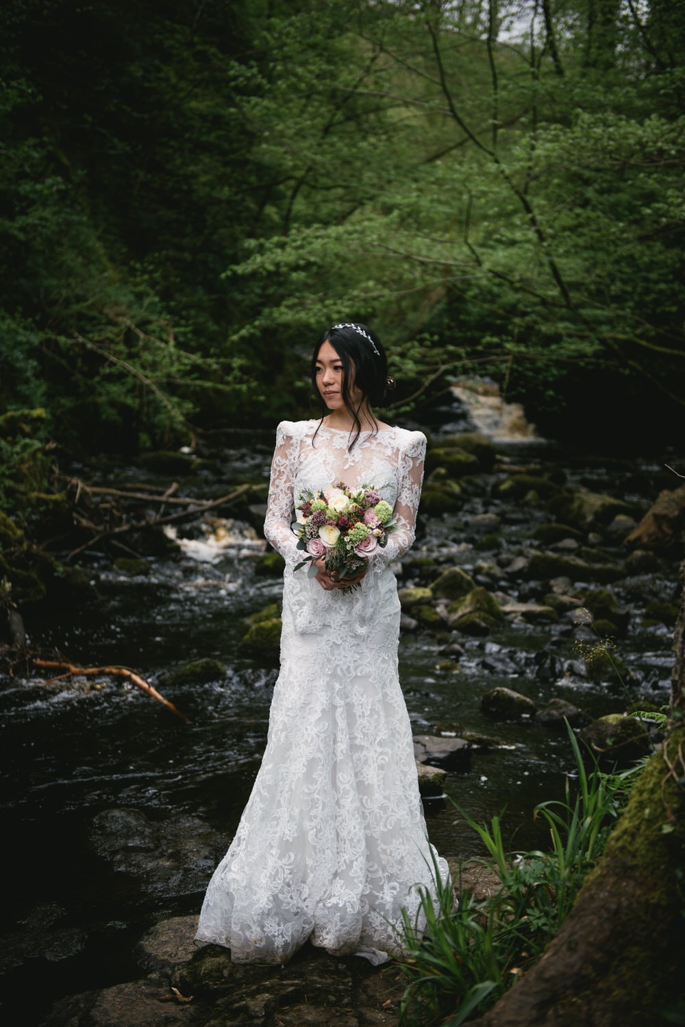 The bride's elegant bridal bouquet, featuring a mix of blooms and greenery during their Northern Ireland elopement.