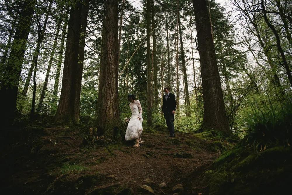 Candid shot of the couple's happy expressions as they explore the rugged landscape of Northern Ireland during their elopement.