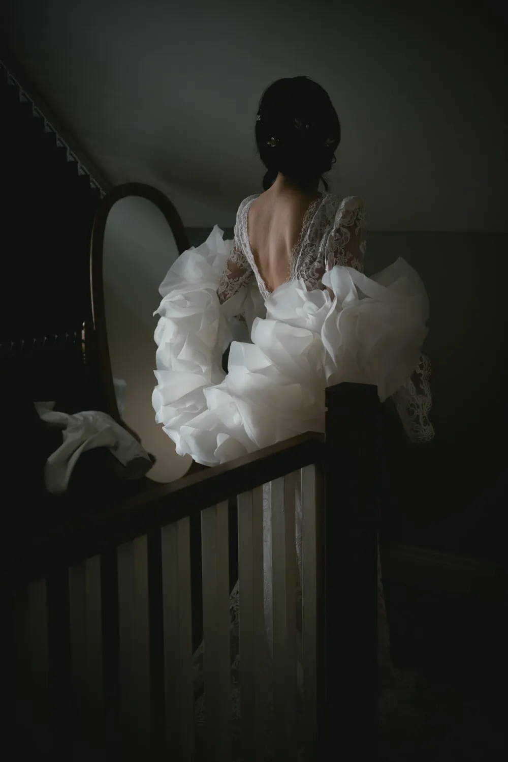 Close-up of the bride's intricate lace veil gently blowing in the breeze during their Northern Ireland elopement.