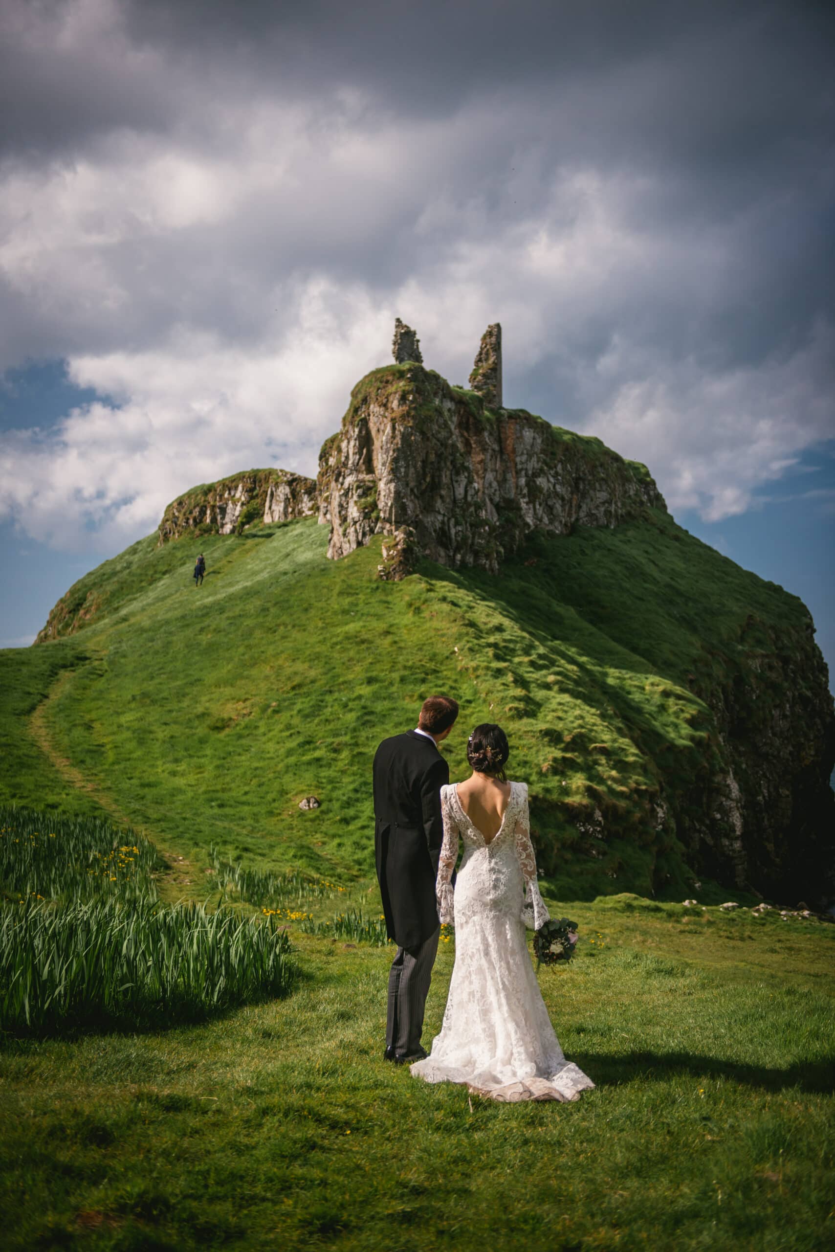 The couple standing in awe of the majestic landscape of Northern Ireland during their elopement.