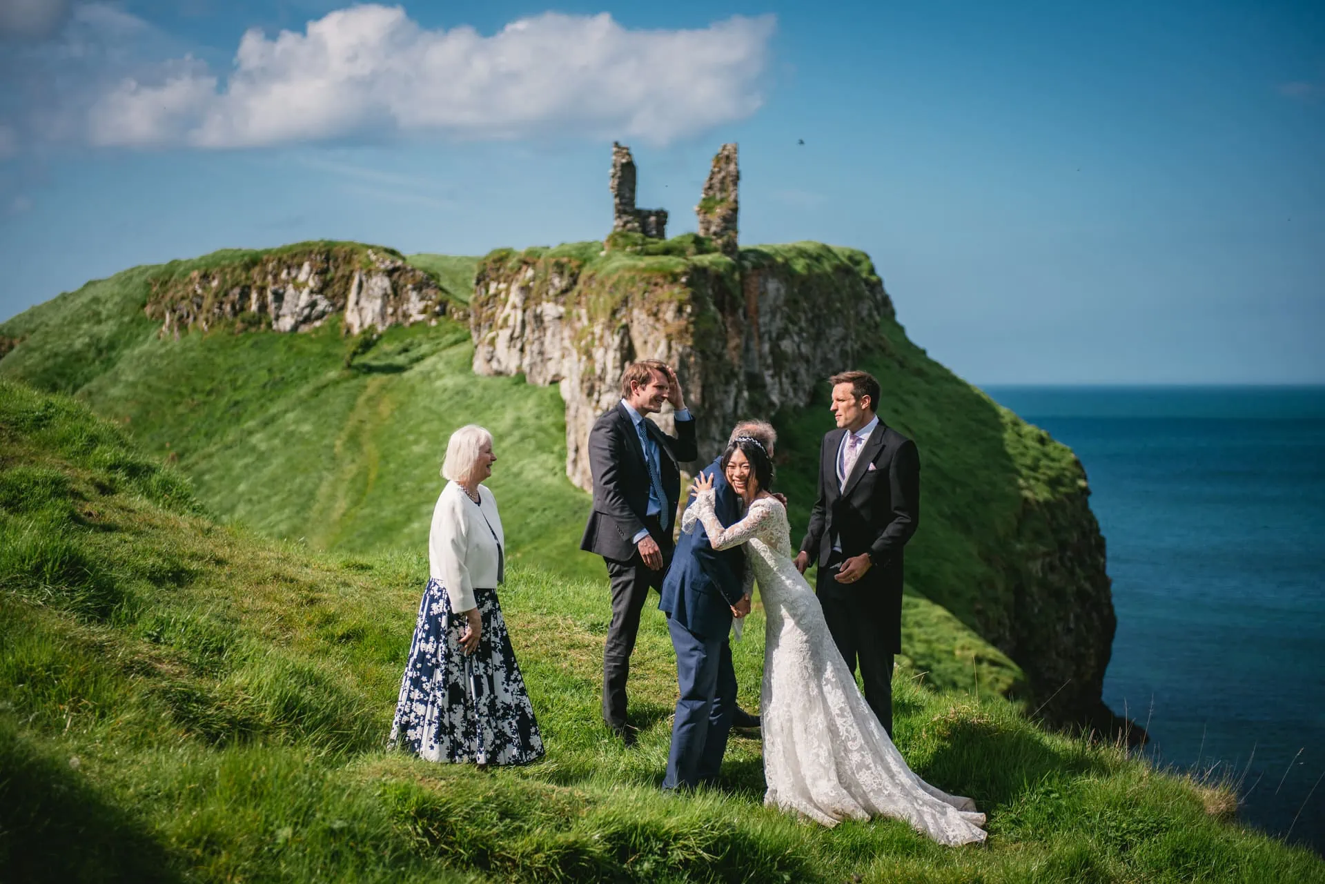 The couple standing in front of an ancient stone doorway at the castle during their Northern Ireland elopement.