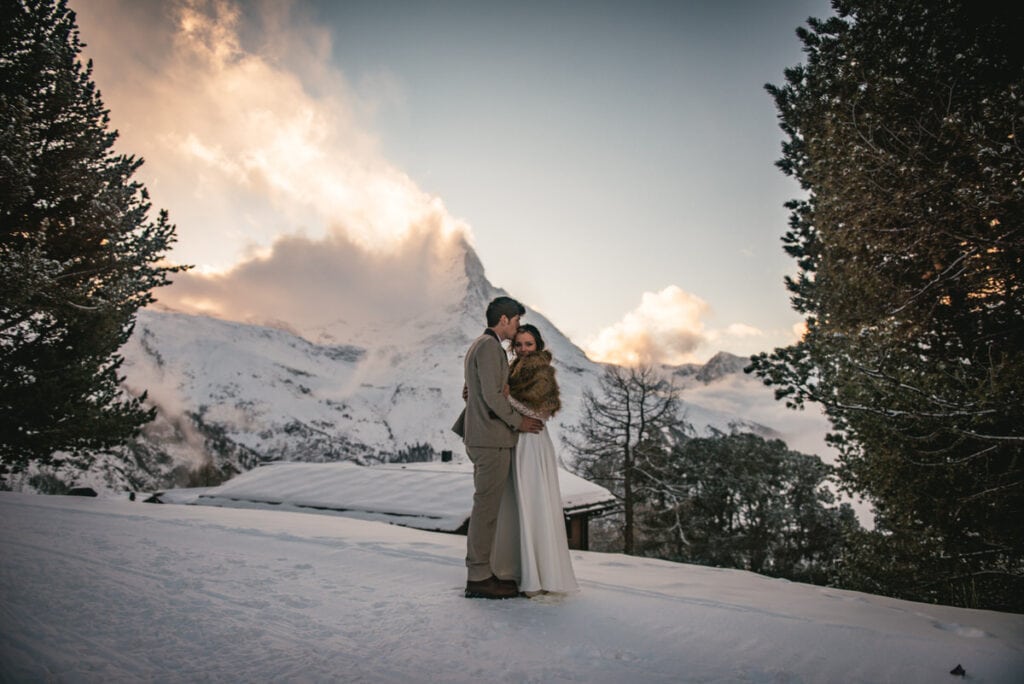 Couple on their winter elopement day in Zermatt with the Matterhorn