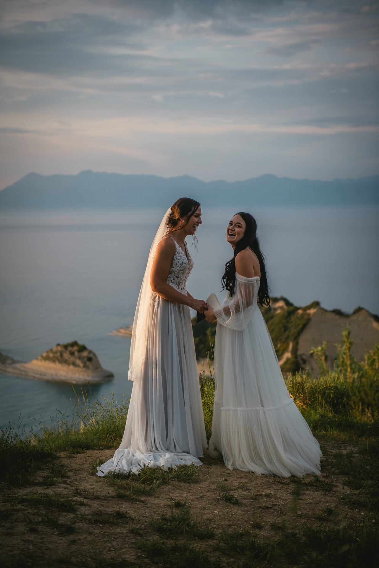 The couple's hands intertwined, exchanging vows in their Corfu elopement.