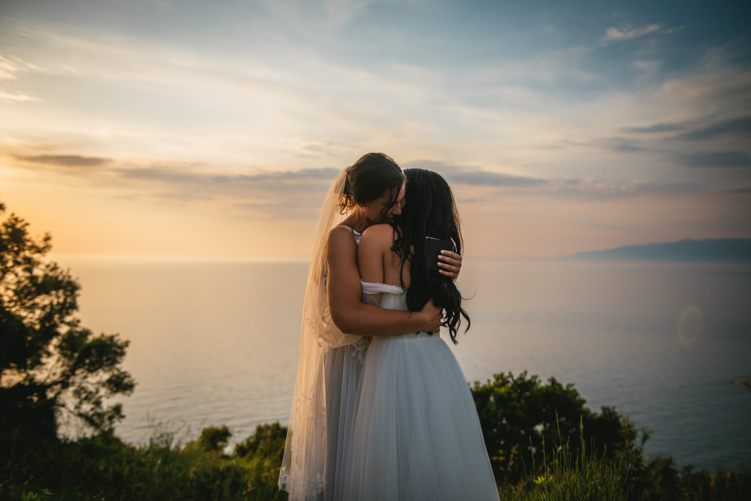 A snapshot of the couple's loving embrace during the Corfu elopement ceremony.
