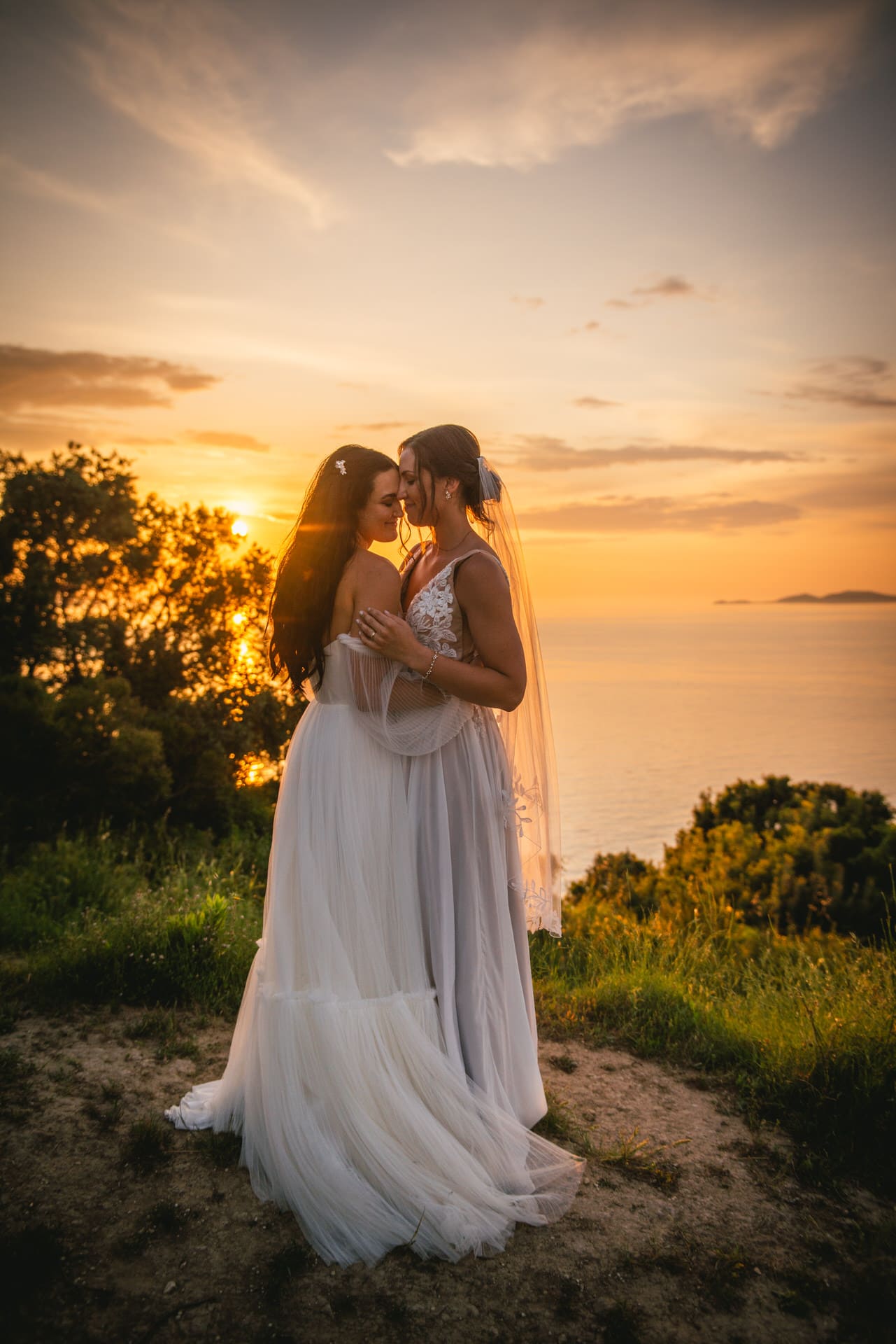 Bride's first dance illuminated by the sunset, a magical moment in Corfu elopement.