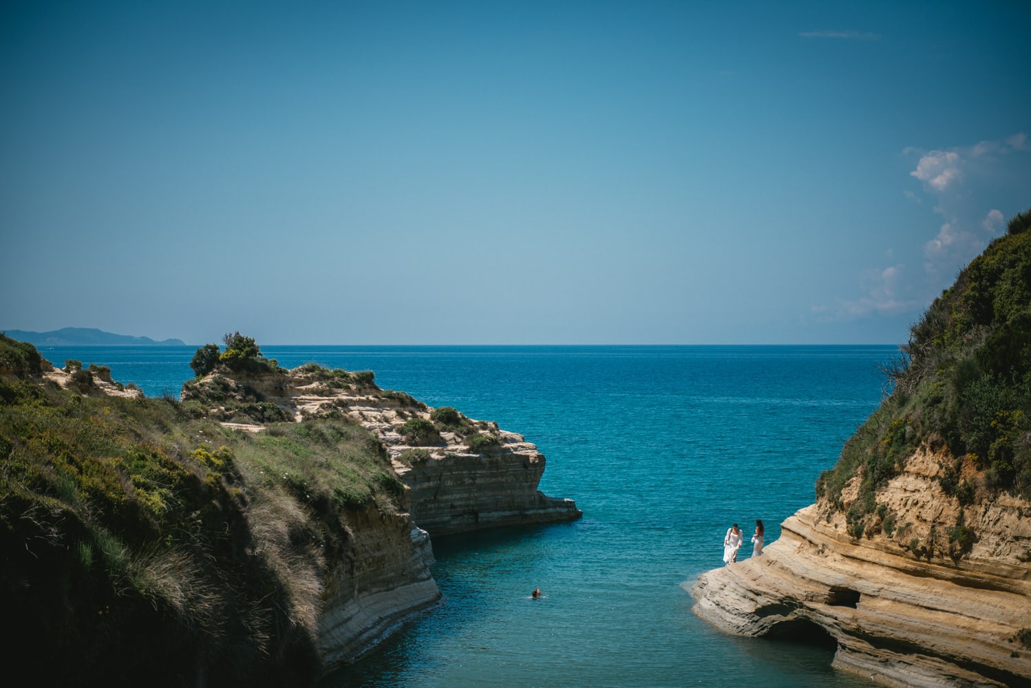 A picturesque moment at the Canal d'Amour, a romantic spot in Corfu for their elopement.