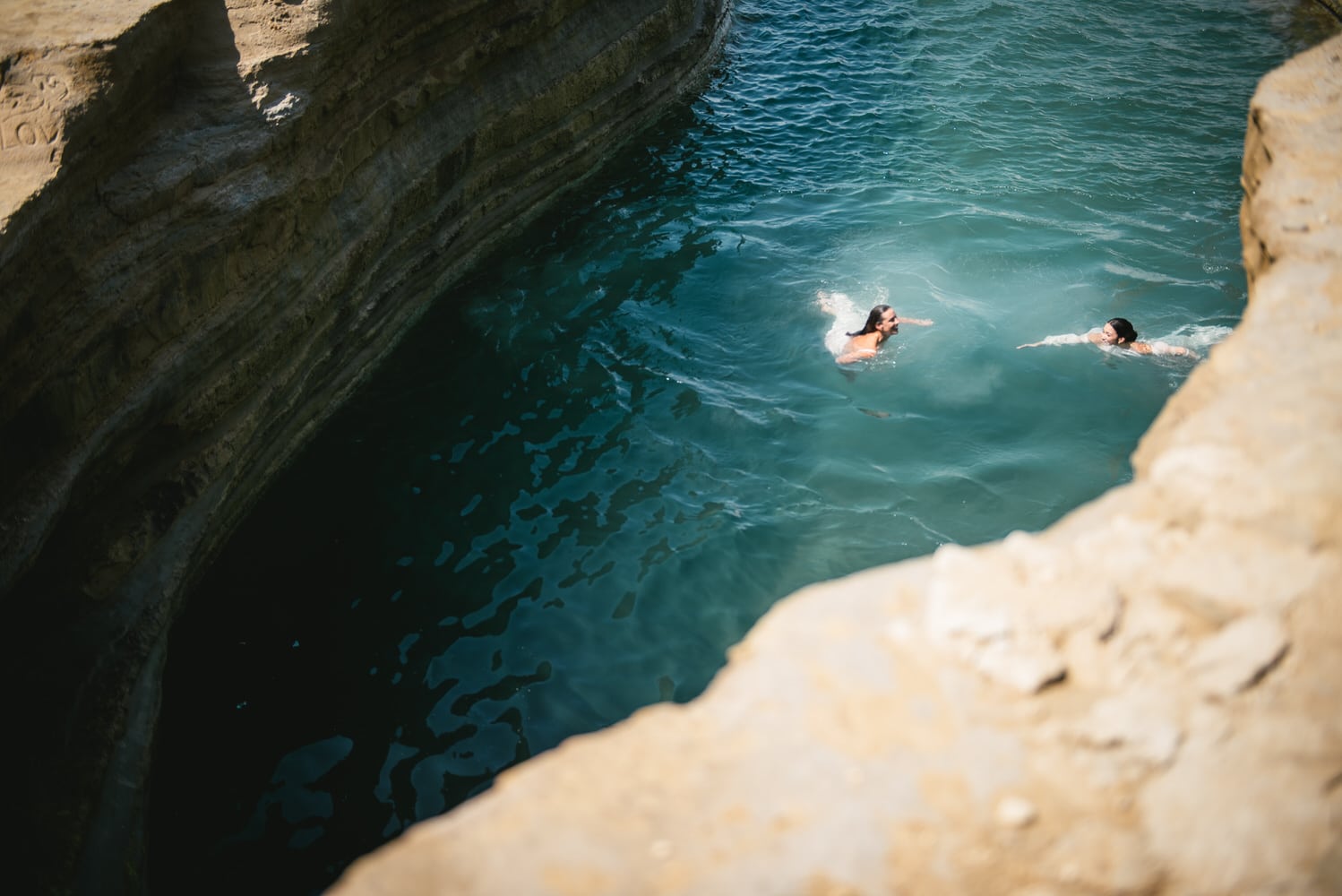 Brides enjoying a refreshing swim during their adventurous Corfu elopement.