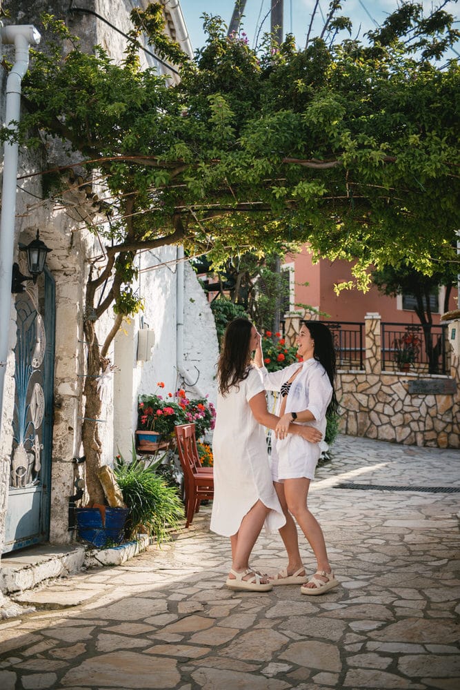 Brides strolling through a stunning white street, creating timeless memories in Corfu.