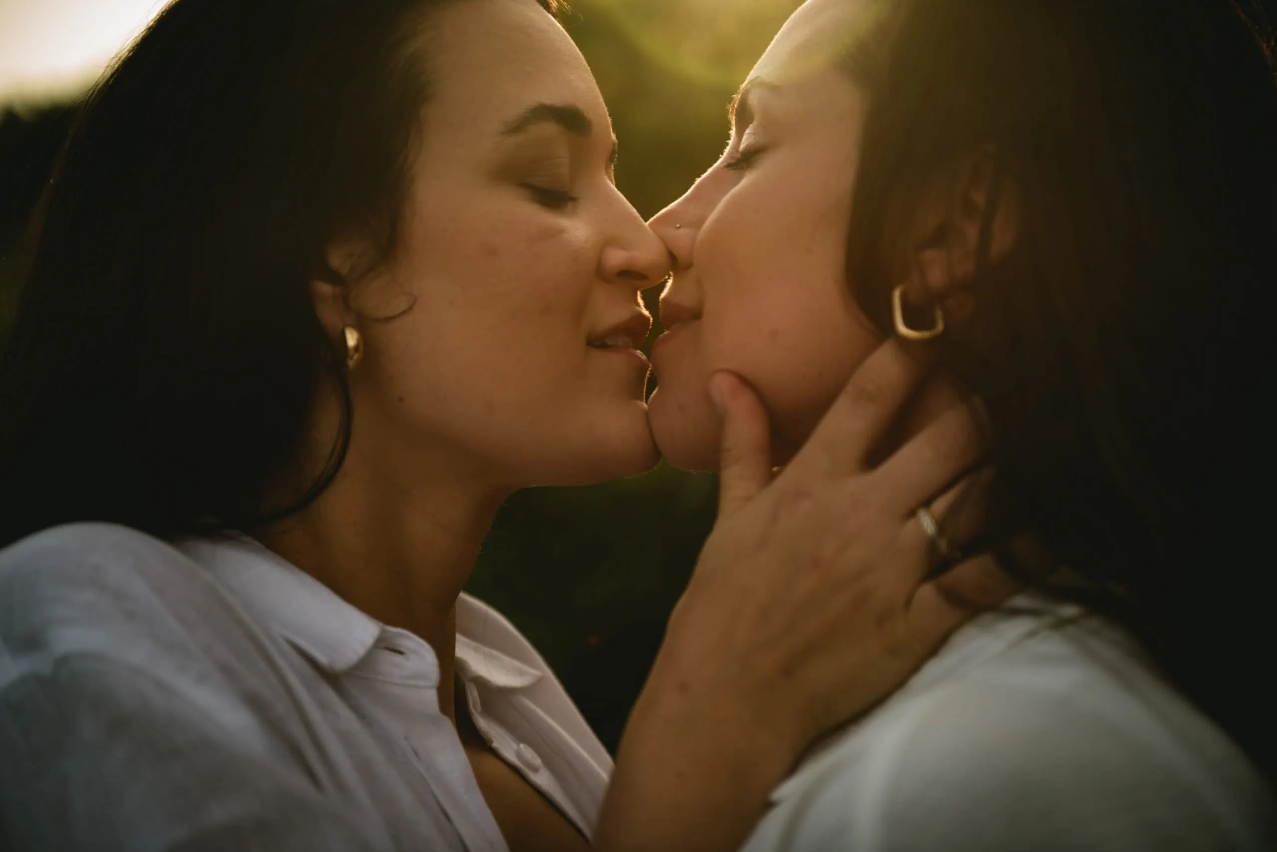 A sweet and affectionate kiss shared by the brides during their romantic Corfu elopement.
