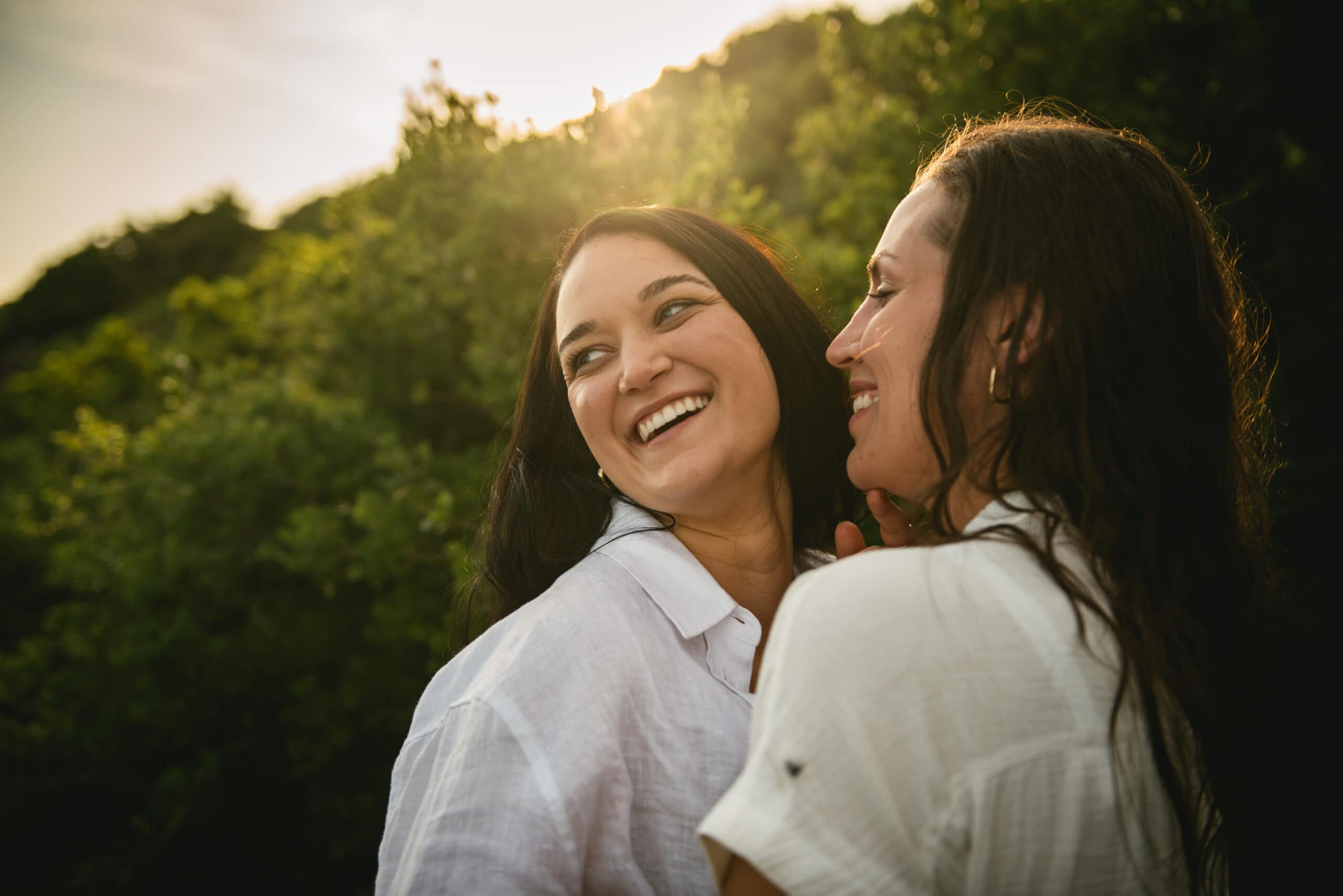 Brides sharing genuine laughter, capturing joyful memories of their Corfu elopement.