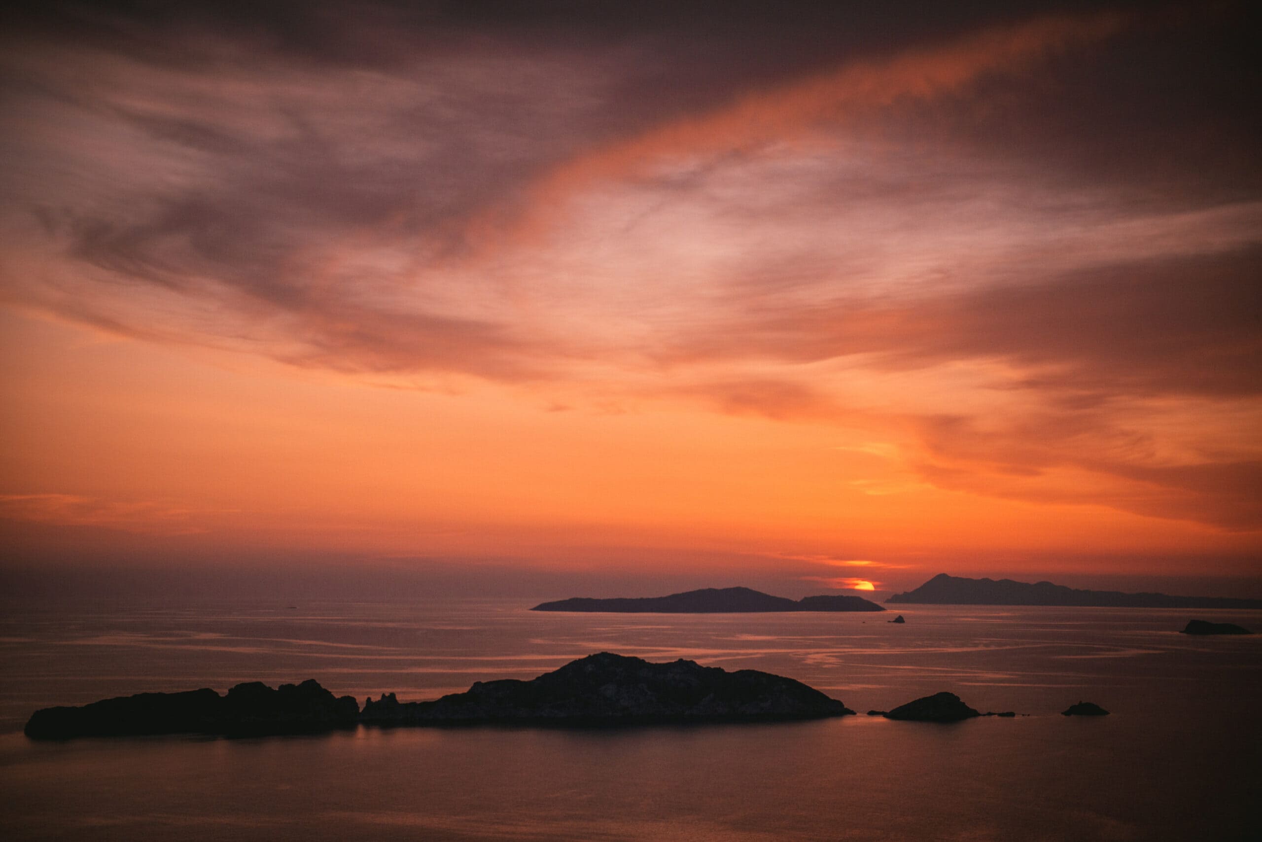 Breathtaking sunset over the stunning Corfu islands, capturing the magic of their elopement.