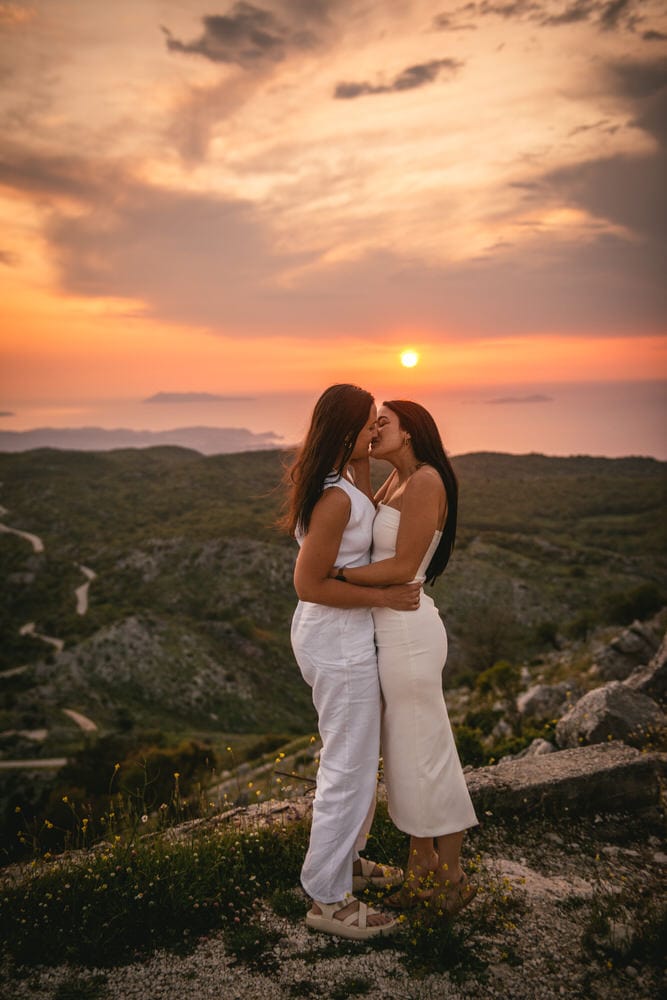Guided by the winding road: Brides' journey to Mount Pantokrator's summit, love leading the way during their Corfu elopement.