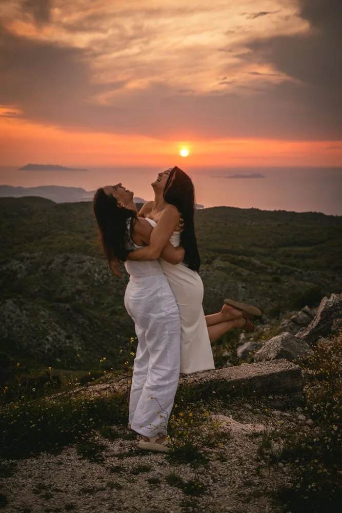 Guided by winding roads: Brides' journey to Mount Pantokrator's summit, love leading the way during their Corfu elopement.
