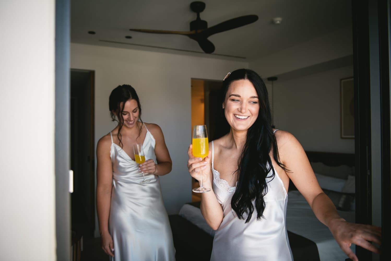 Brides enjoying mimosas, laughter and joy on their Corfu elopement morning.