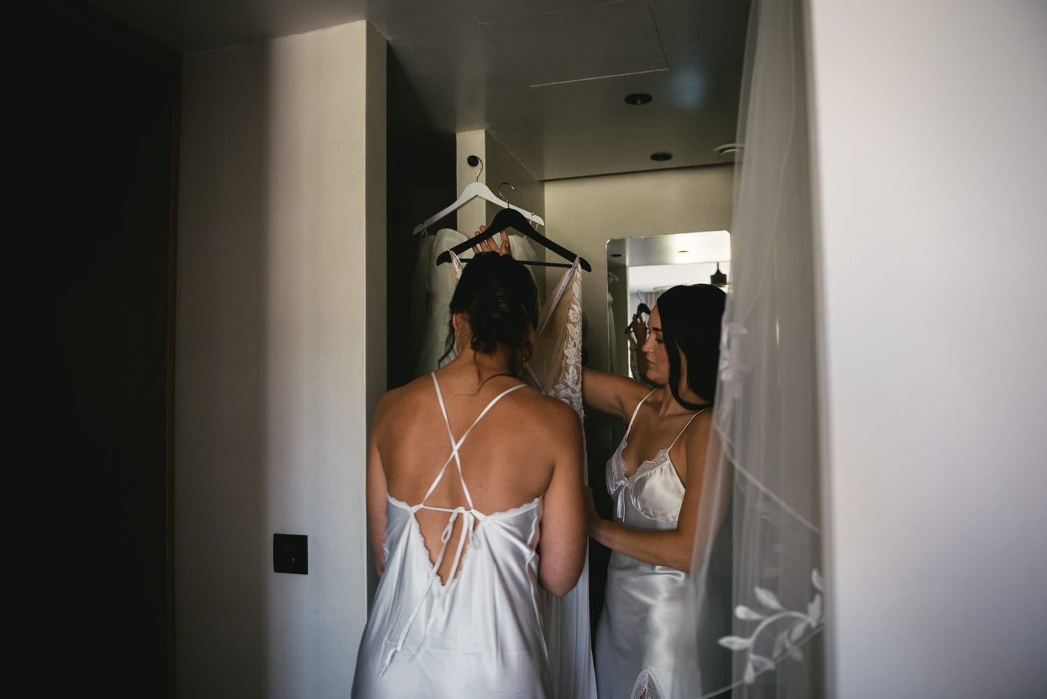 Brides getting ready for their Corfu elopement, excitement filling the room.